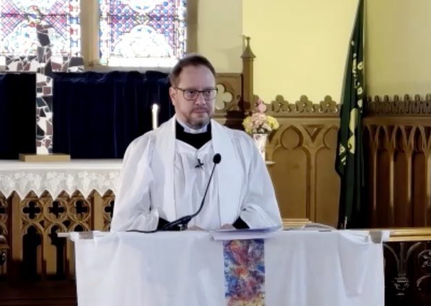 Rev Adam Pullen at Prayer Desk